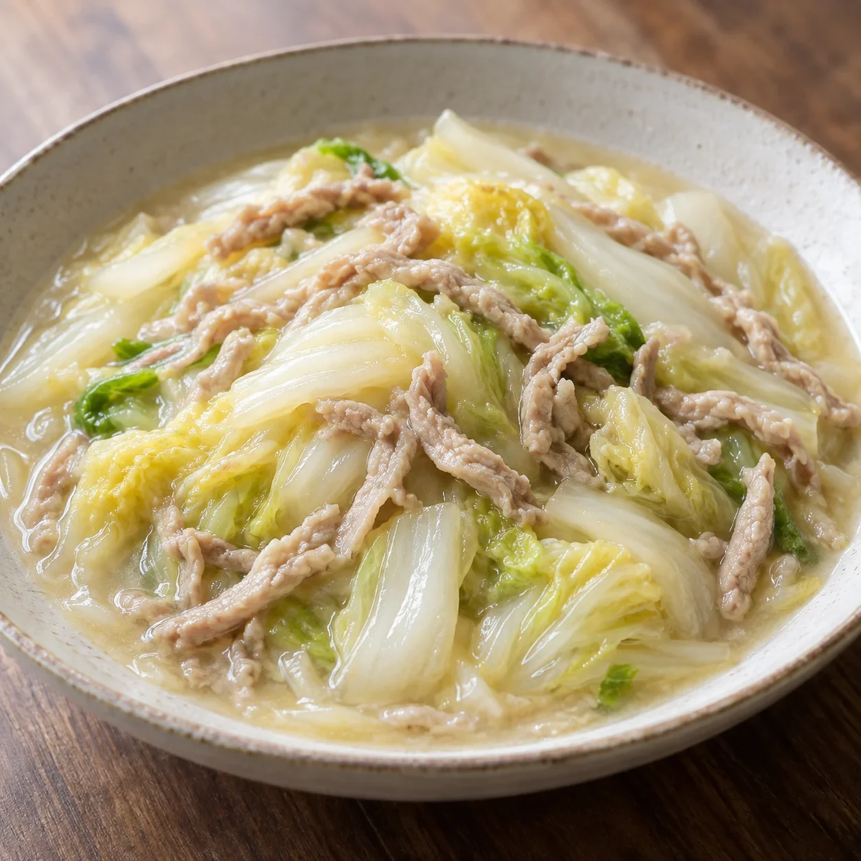 AI-generated editorial illustration of Soft napa cabbage with shredded pork.
