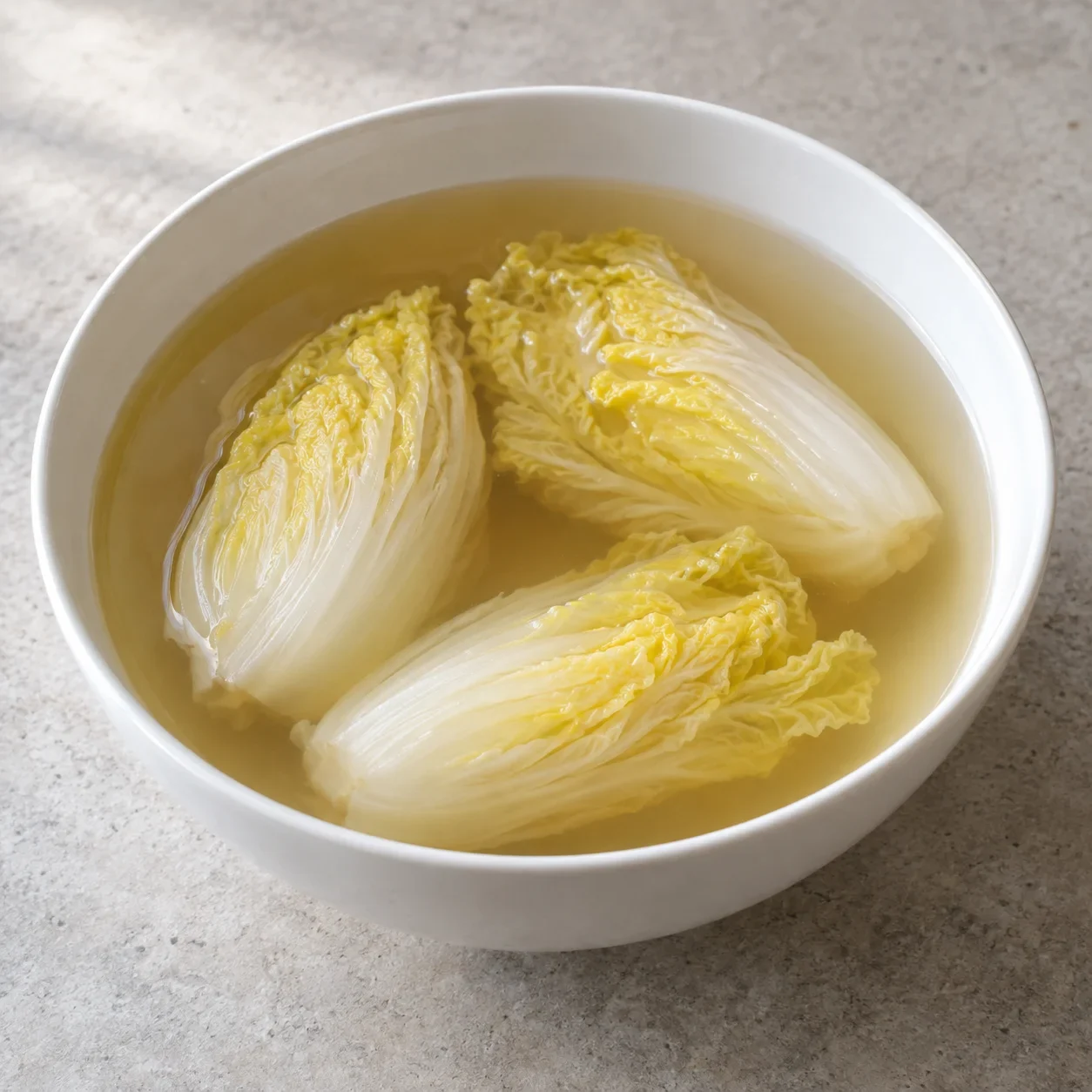 AI-generated editorial illustration of Cabbage hearts in clarified broth.